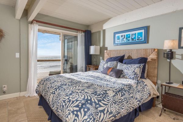 vacation beach house master bedroom with ocean view and beach access